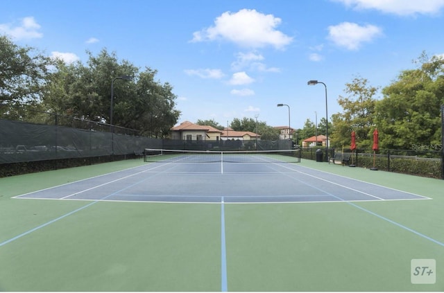 view of sport court featuring basketball hoop