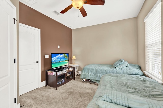 bedroom with light colored carpet and ceiling fan