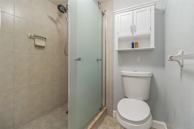 bathroom with toilet and walk in shower