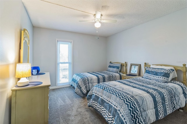 carpeted bedroom with a textured ceiling and ceiling fan