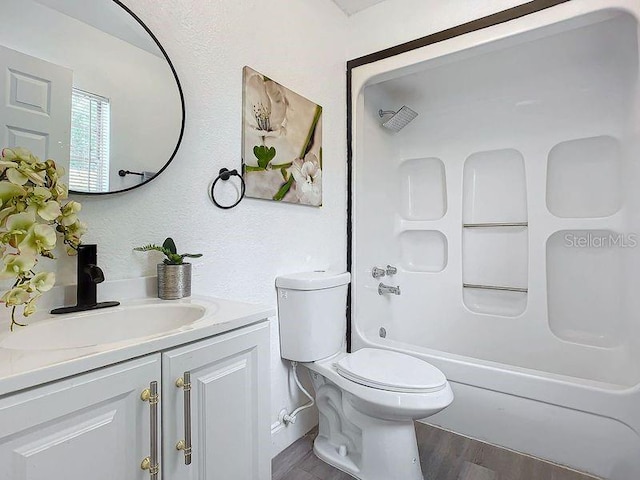 bathroom featuring vanity, toilet, and hardwood / wood-style flooring