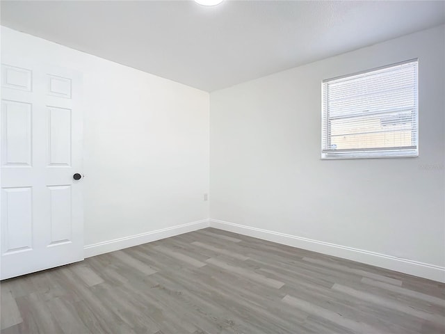 unfurnished room featuring hardwood / wood-style floors