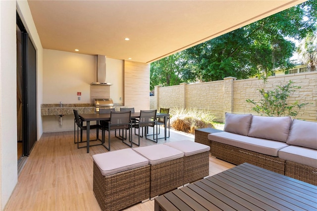 exterior space featuring outdoor lounge area and grilling area