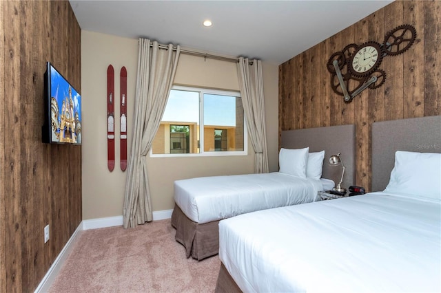 bedroom with carpet and wooden walls