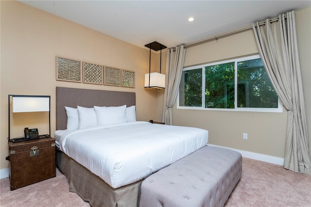 bedroom featuring light colored carpet