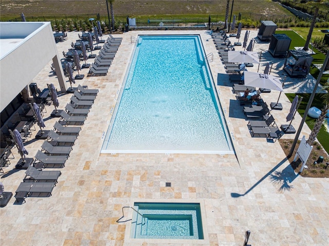 view of swimming pool with a patio