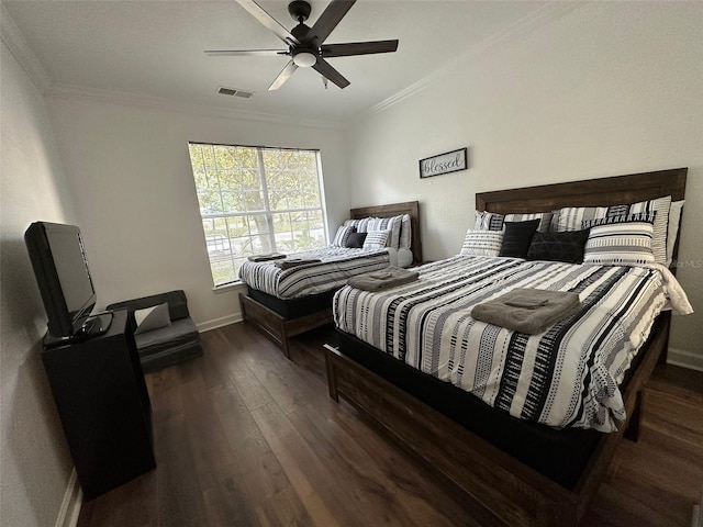 bedroom with ceiling fan, dark hardwood / wood-style flooring, and crown molding