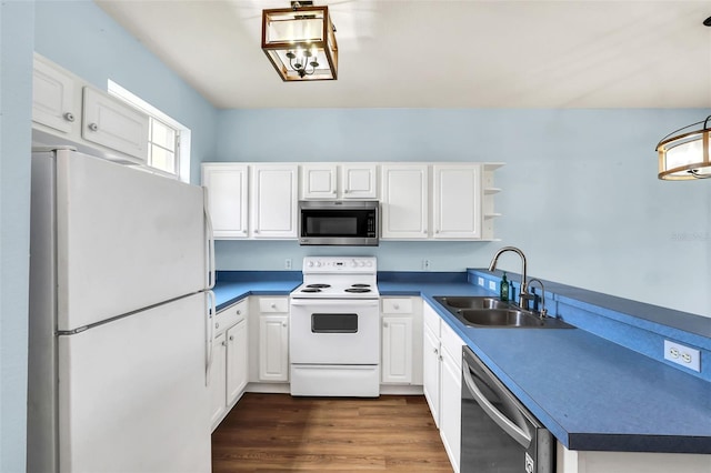 kitchen featuring open shelves, stainless steel appliances, dark wood-type flooring, white cabinets, and a sink