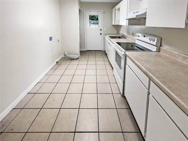 kitchen featuring light tile patterned flooring, under cabinet range hood, electric range, a sink, and white cabinetry