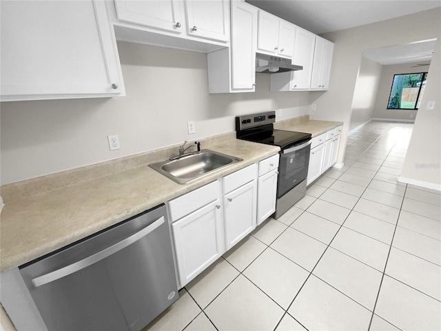 kitchen featuring light tile patterned floors, white cabinetry, stainless steel appliances, and sink