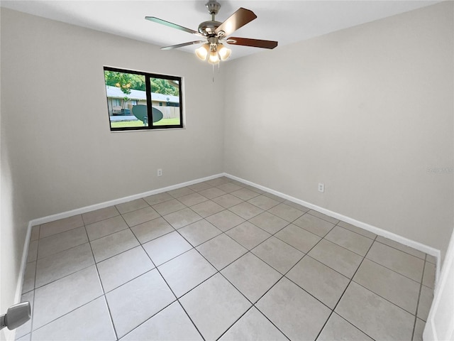 spare room with light tile patterned flooring and ceiling fan