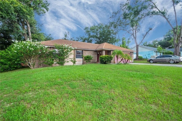 single story home with a front yard