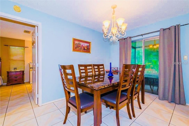 tiled dining space with a chandelier