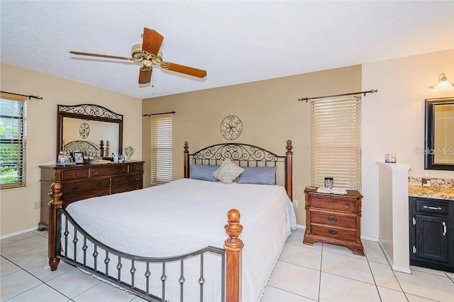 tiled bedroom with a textured ceiling and ceiling fan