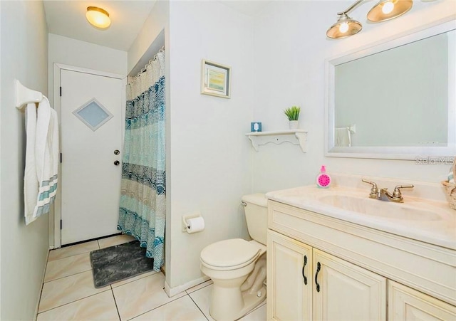 bathroom with vanity, toilet, curtained shower, and tile patterned flooring