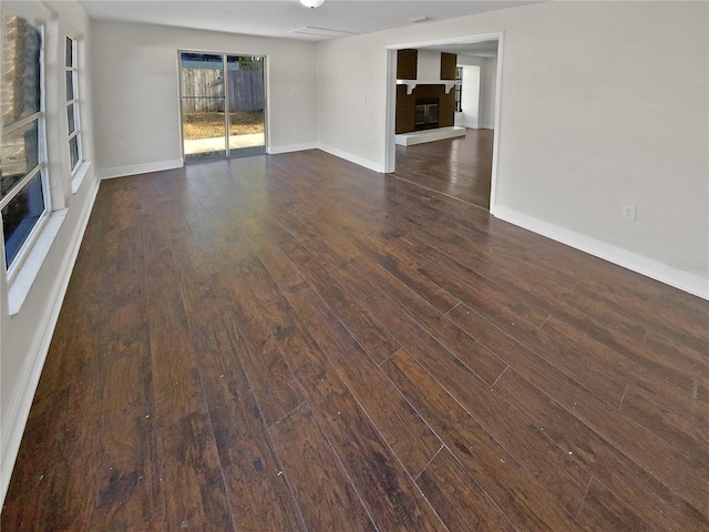 interior space with dark hardwood / wood-style floors and a fireplace