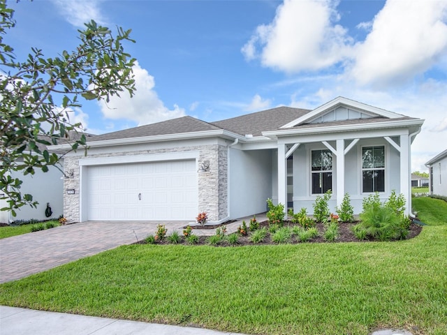 view of front facade with a front lawn and a garage