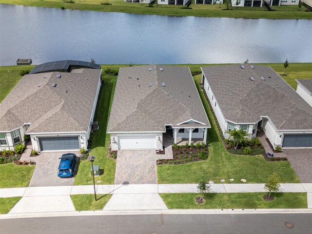 birds eye view of property with a water view