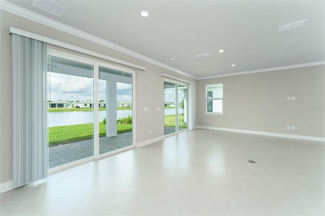 unfurnished room featuring ornamental molding, a water view, and light tile patterned floors