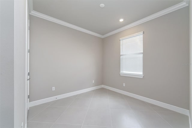 tiled empty room featuring ornamental molding