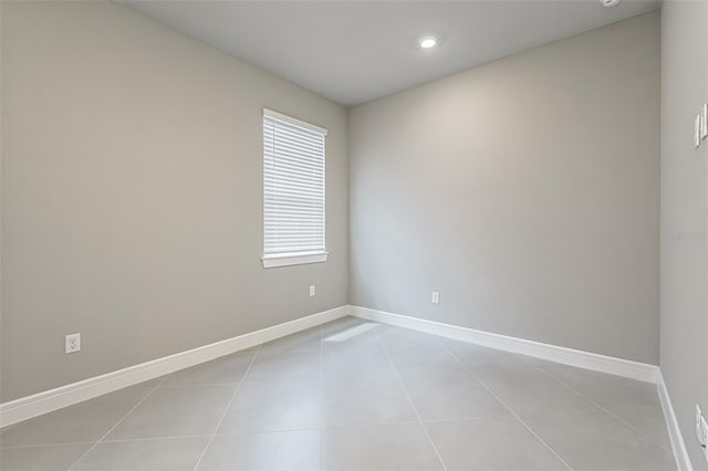 unfurnished room featuring light tile patterned floors