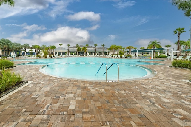 view of swimming pool featuring a patio area