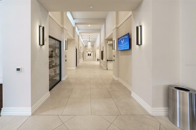 hallway featuring light tile patterned flooring