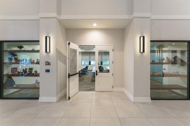 hallway with light tile patterned floors