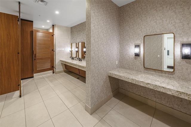 bathroom with tile patterned floors and vanity