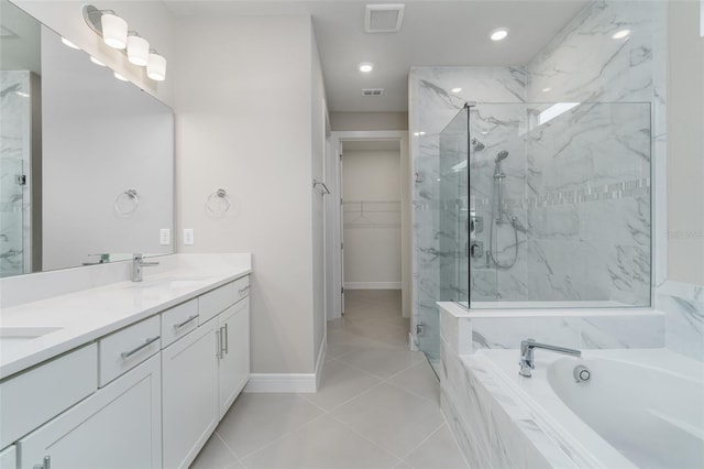 bathroom featuring vanity, separate shower and tub, and tile patterned floors