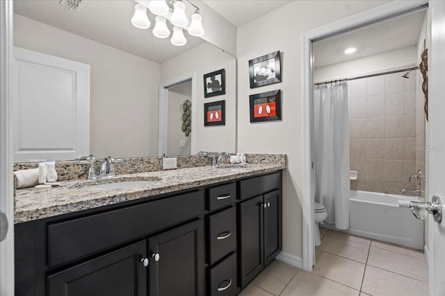 full bathroom featuring shower / bath combination with curtain, vanity, tile patterned floors, and toilet