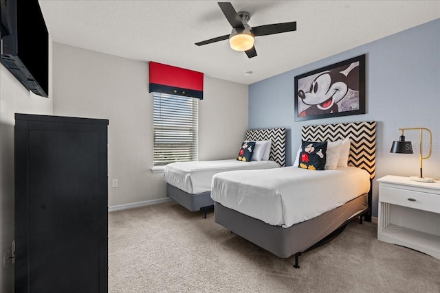 bedroom with light colored carpet and ceiling fan