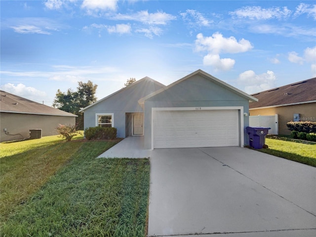 single story home with a garage, central AC unit, and a front yard