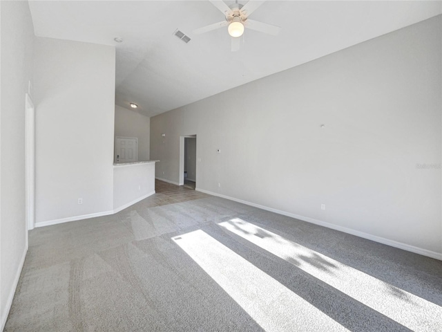 unfurnished living room with lofted ceiling, visible vents, a ceiling fan, carpet flooring, and baseboards