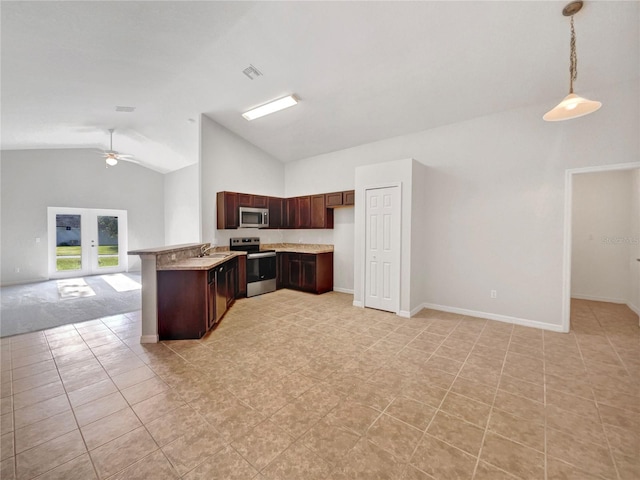 kitchen featuring appliances with stainless steel finishes, sink, ceiling fan, kitchen peninsula, and pendant lighting