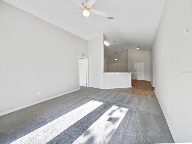 carpeted empty room featuring lofted ceiling and ceiling fan