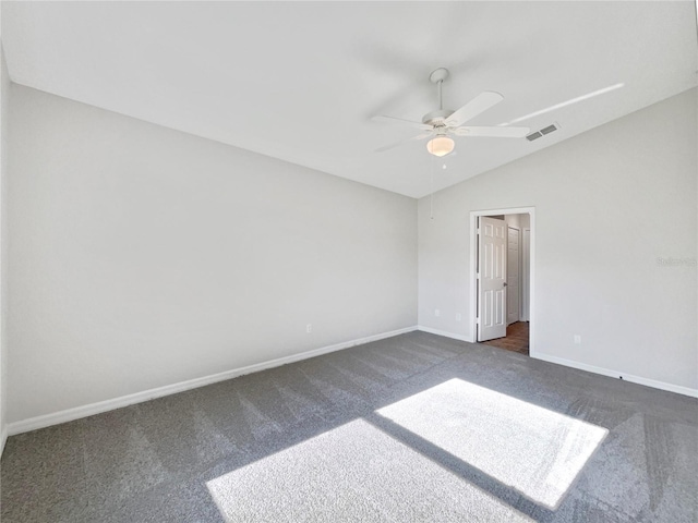 unfurnished room featuring a ceiling fan, visible vents, vaulted ceiling, baseboards, and dark colored carpet