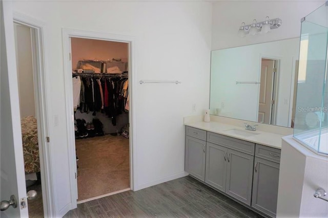 bathroom with vanity and hardwood / wood-style floors