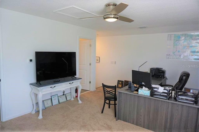 home office with light carpet and ceiling fan