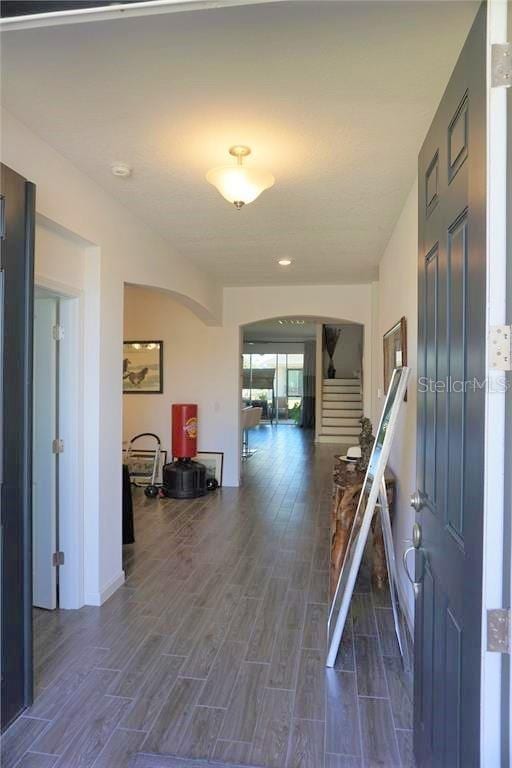 corridor featuring dark hardwood / wood-style flooring