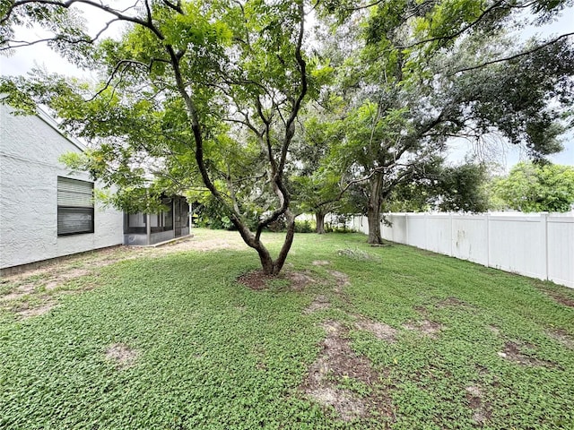 view of yard featuring a sunroom