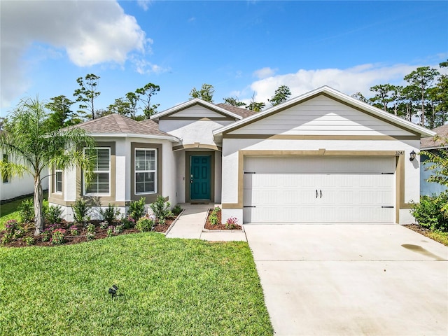 ranch-style home featuring a garage and a front lawn