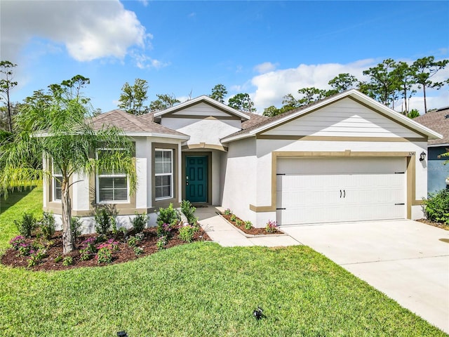 view of front of house featuring a front yard and a garage