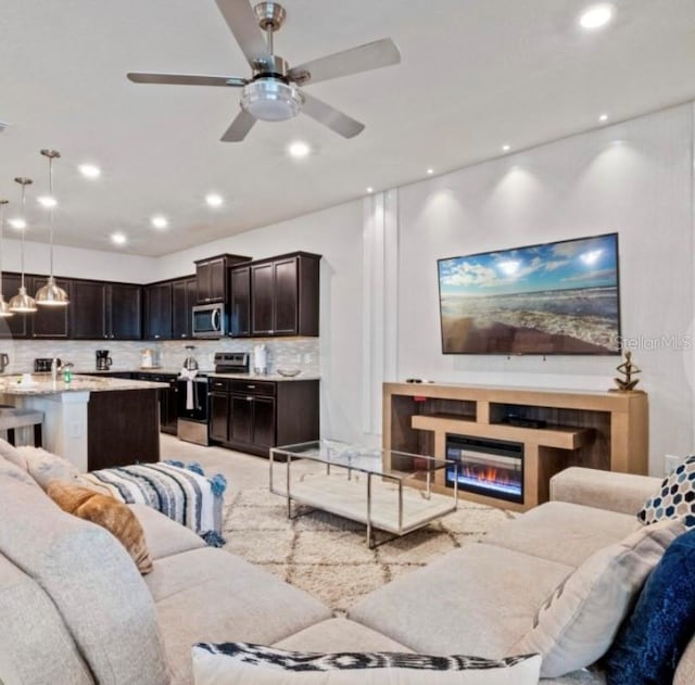 living room featuring ceiling fan