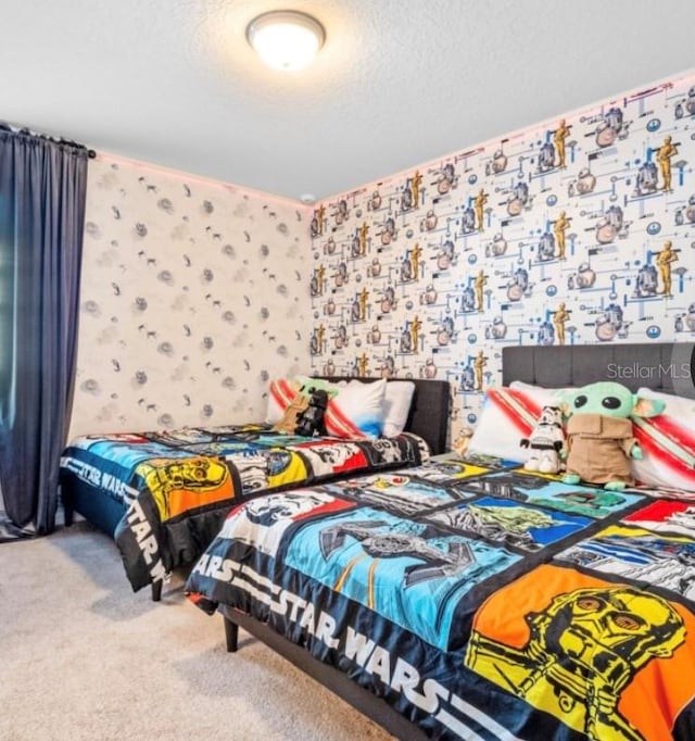 carpeted bedroom with a textured ceiling