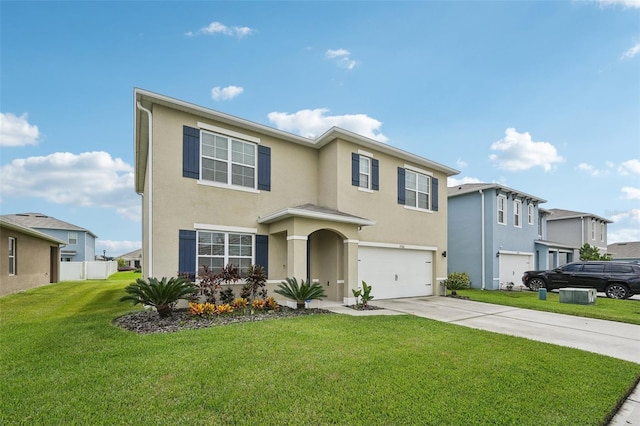 view of front of house with a front yard and a garage