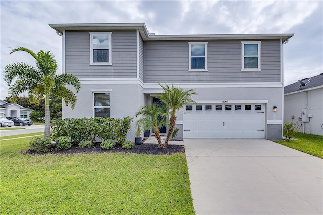 14007 Creek Harbor Dr, Orlando, FL 32824 - view of front of home with stucco siding, driveway, a front yard, and an attached garage