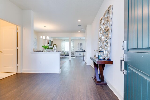 14007 Creek Harbor Dr, Orlando, FL 32824 - foyer entrance featuring dark wood finished floors, a notable chandelier, recessed lighting, and baseboards