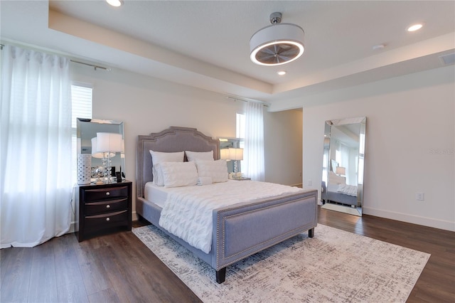 14007 Creek Harbor Dr, Orlando, FL 32824 - bedroom with recessed lighting, a tray ceiling, baseboards, and wood finished floors
