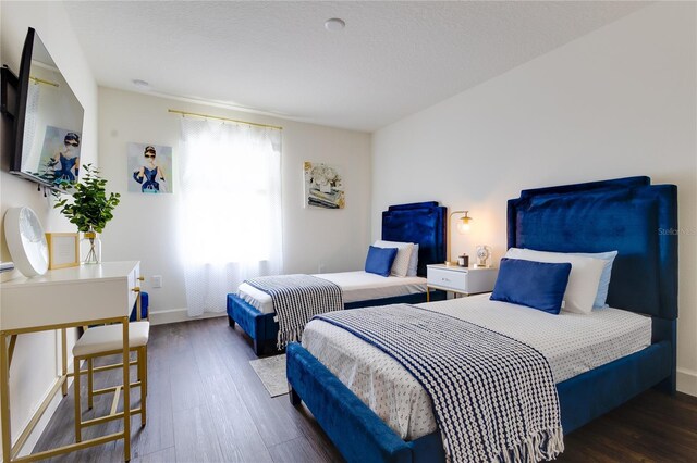 14007 Creek Harbor Dr, Orlando, FL 32824 - bedroom featuring baseboards and wood finished floors